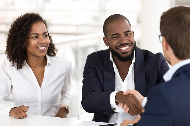 Two men shaking hands after a successful meeting 2